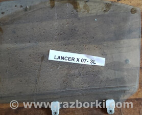 Скло дверне заднє ліве Mitsubishi Lancer
